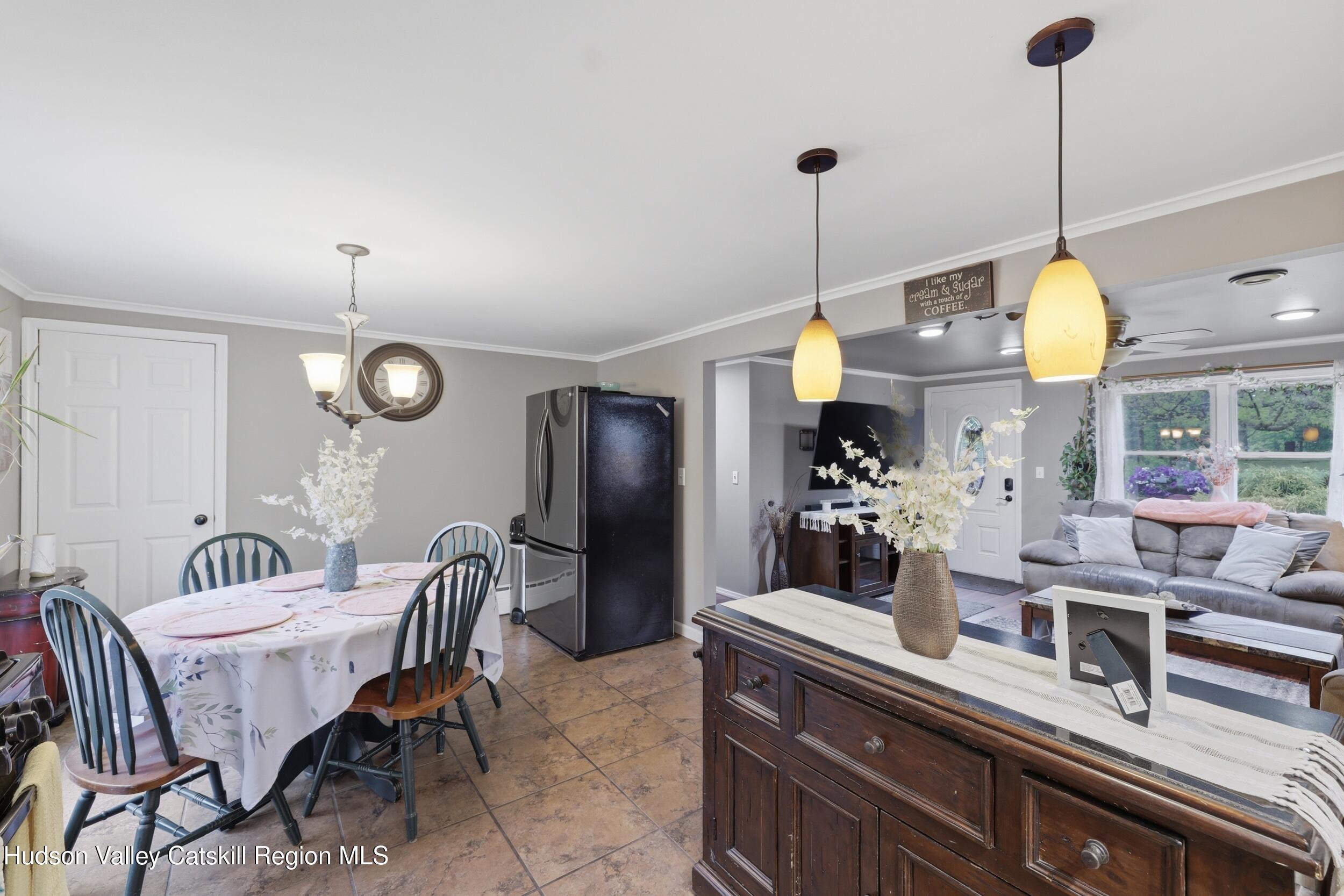 186 Cedar Hill Road High Falls, NY 12440 - Photo 12 of 33 a view of a dining room with furniture and chandelier