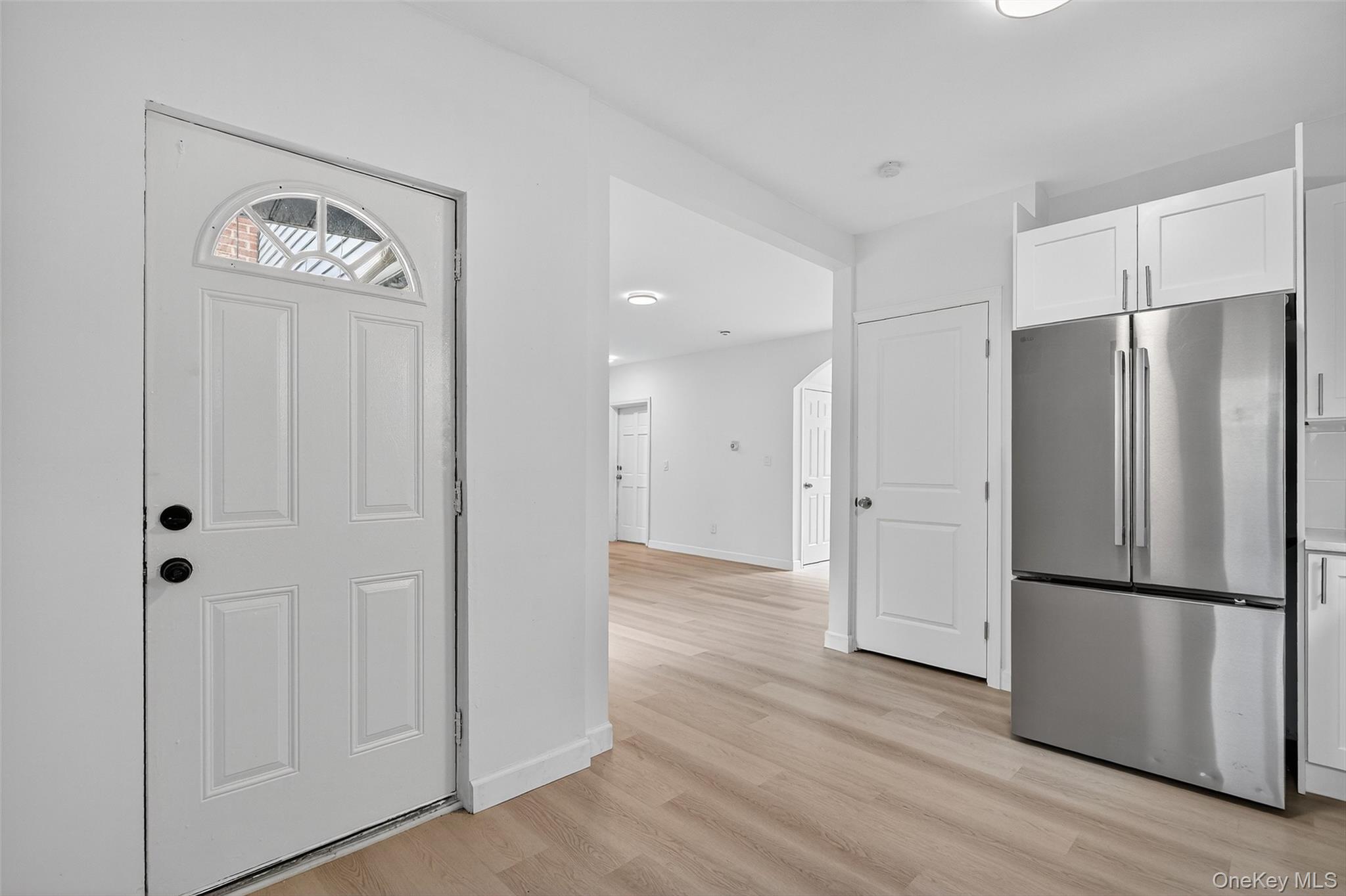23 Ann Street, Unit 1 Ossining, NY 10562 - Photo 24 of 30 a view of a refrigerator in kitchen and wooden floor