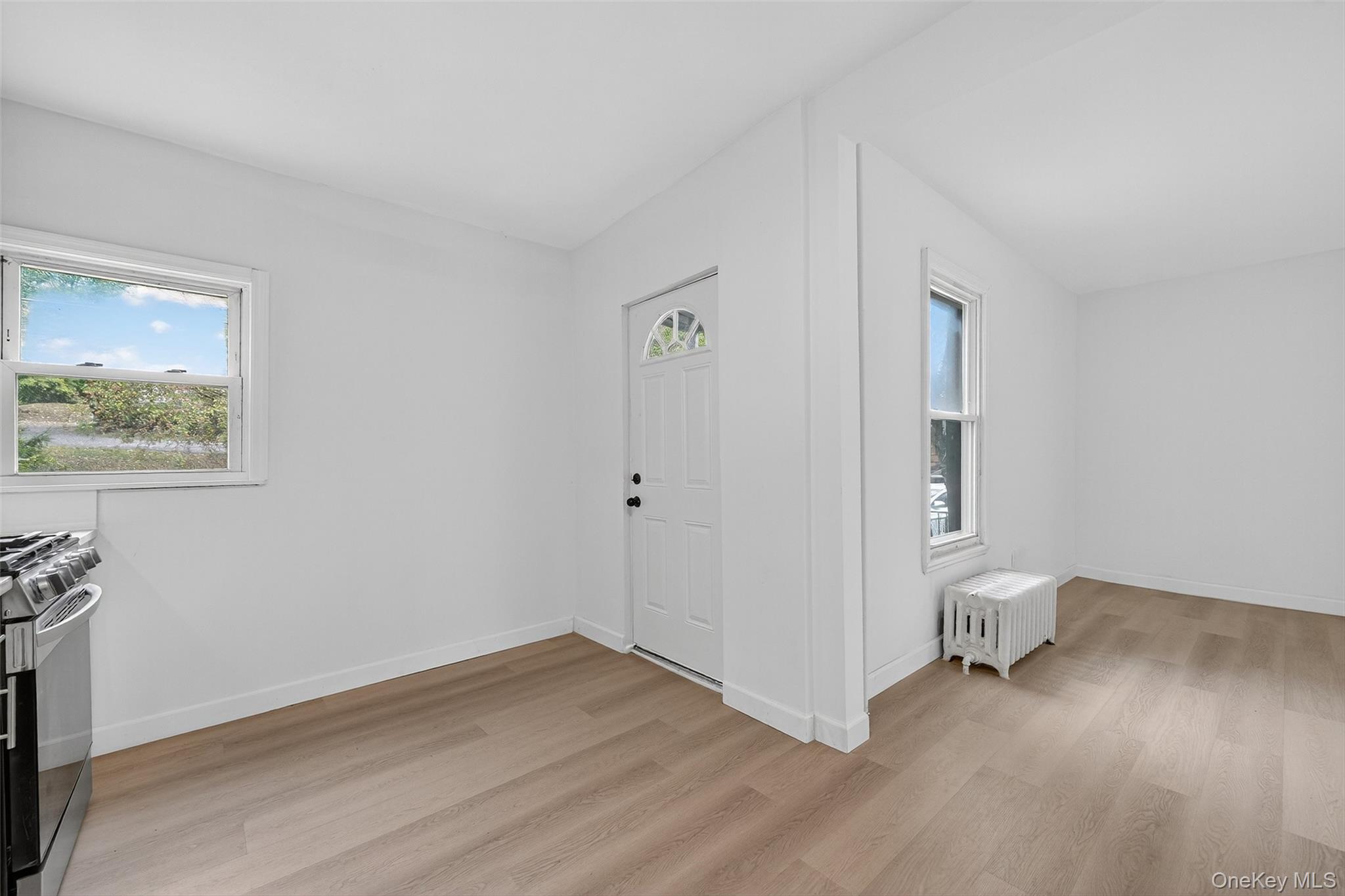 23 Ann Street, Unit 1 Ossining, NY 10562 - Photo 25 of 30 a view of room with wooden floor and white walls