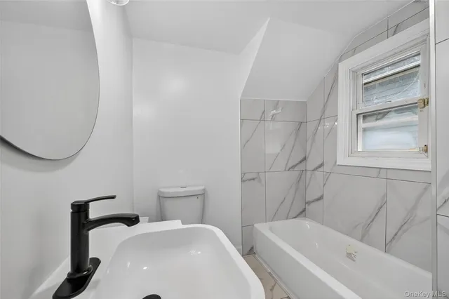 a bathroom with a sink and a bathtub