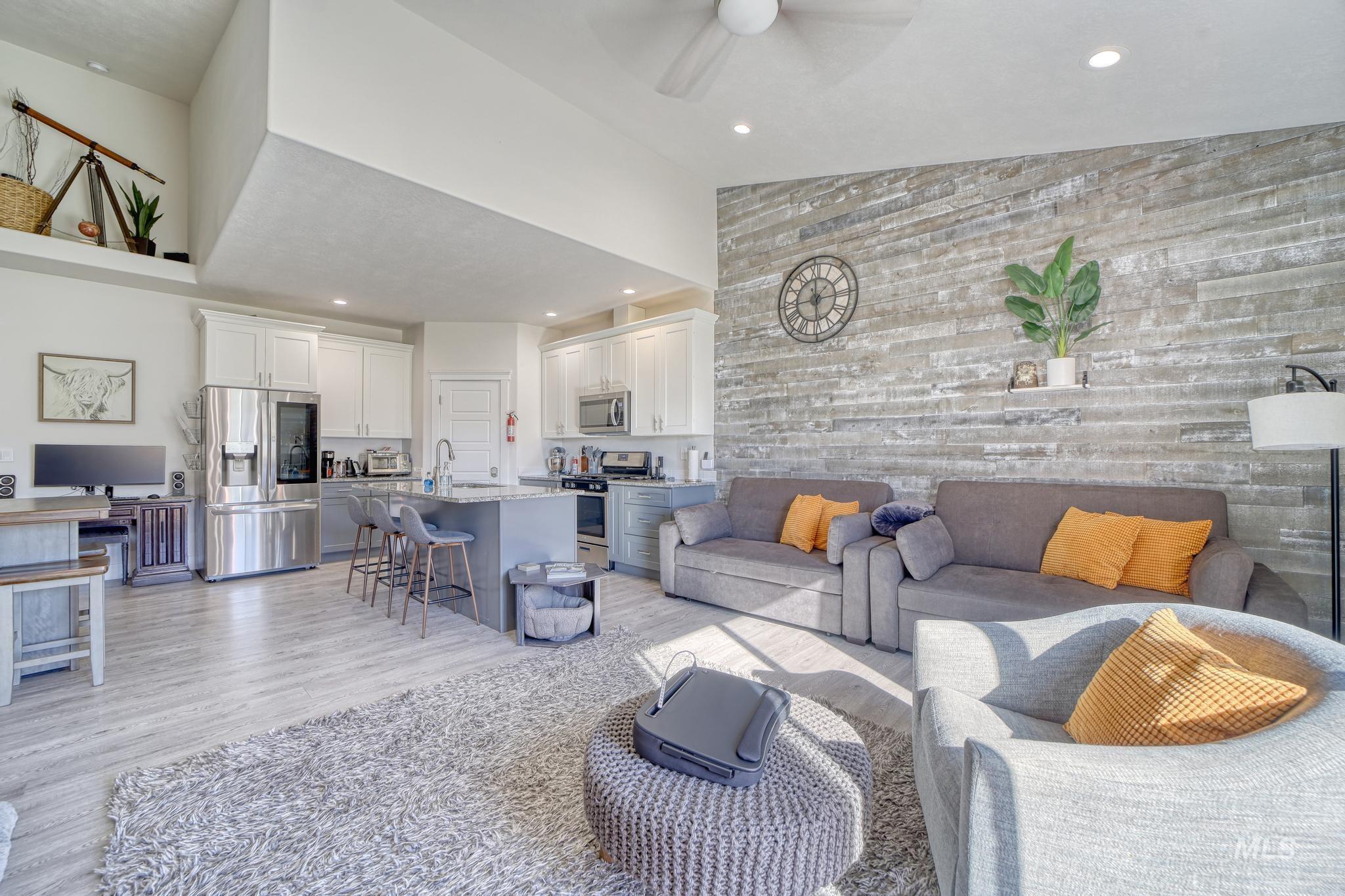 1087 Easy Avenue Twin Falls, ID 83301 - Photo 4 of 25 Living area featuring light wood finished floors, recessed lighting, high vaulted ceiling, and a ceiling fan