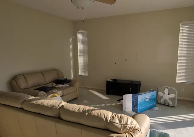 a living room with furniture and a window