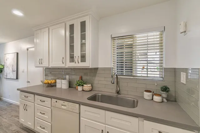 a kitchen with sink and window
