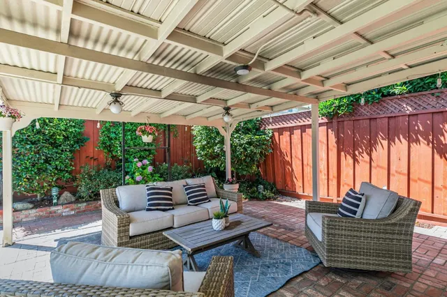 a outdoor living space with furniture and garden view