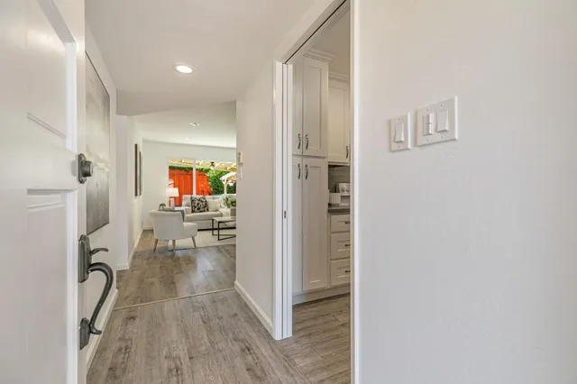 a view of a living room and a wooden floor