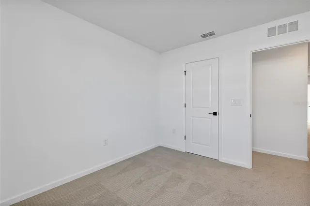 an aerial view of a house with a garden and plants