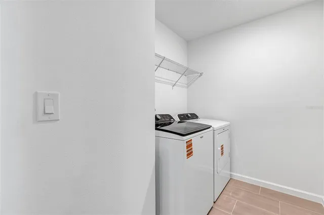 a swimming pool with outdoor seating and yard