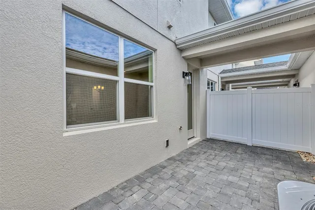 a large white kitchen with a large window