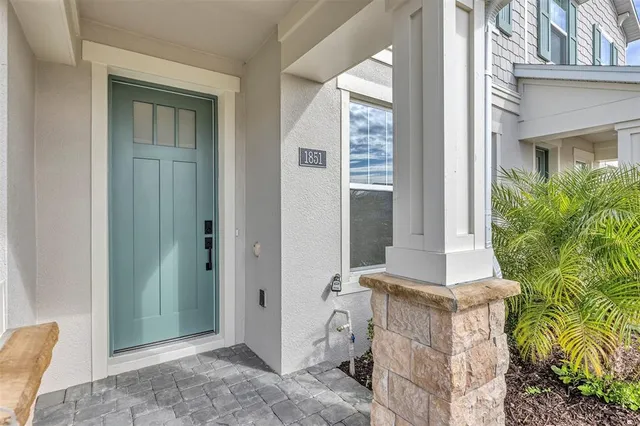 a view of a room with an empty space and wooden floor