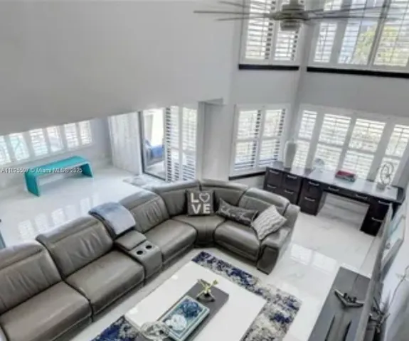 a bedroom with a bed and a television