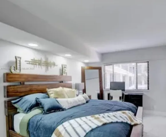 a bathroom with a sink a toilet and a window