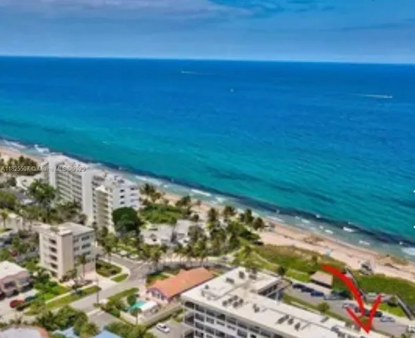 a kitchen with stainless steel appliances granite countertop a sink and a refrigerator