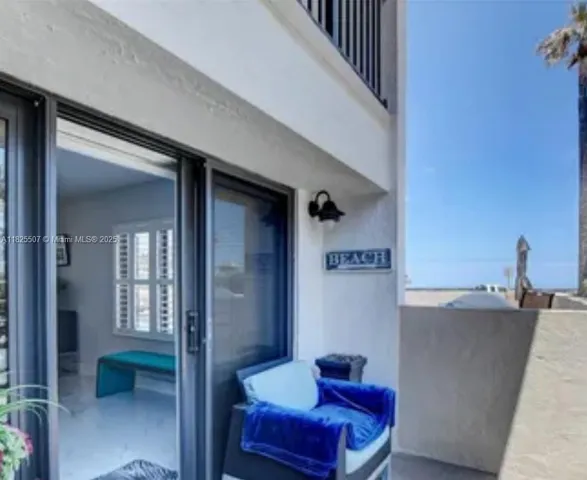 a front view of a house with large windows