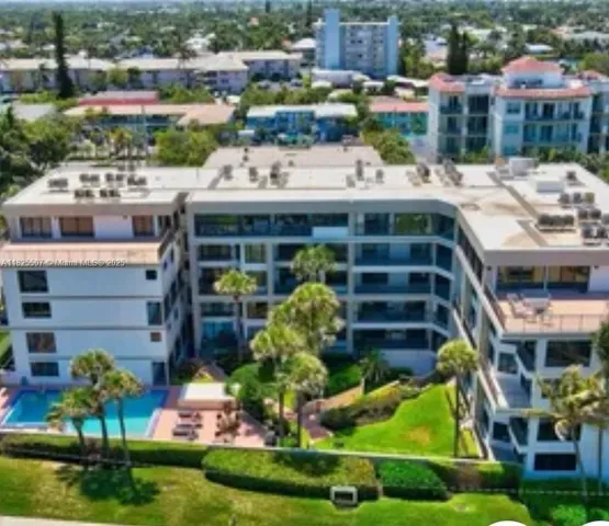 a view of a two chairs in the backyard