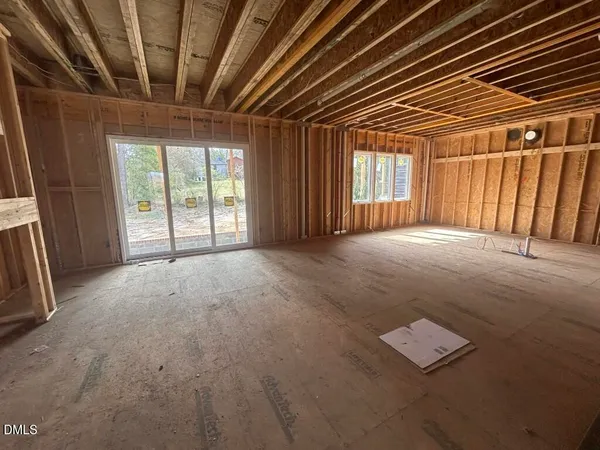 a view of an empty room with windows
