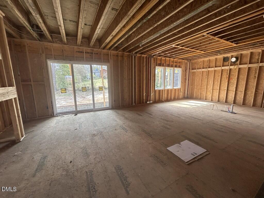1003 Phoenix Place Raleigh, NC 27610 - Photo 2 of 7 a view of an empty room with windows