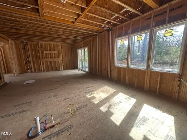 a view of an empty room with a balcony