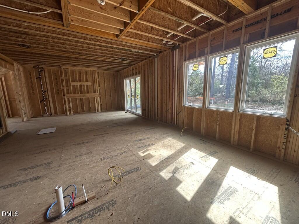 1003 Phoenix Place Raleigh, NC 27610 - Photo 3 of 7 a view of an empty room with a balcony
