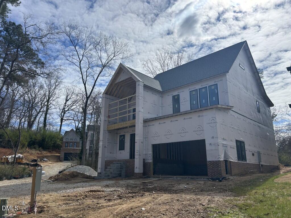 1003 Phoenix Place Raleigh, NC 27610 - Photo 6 of 7 a view of a house with a yard and large tree