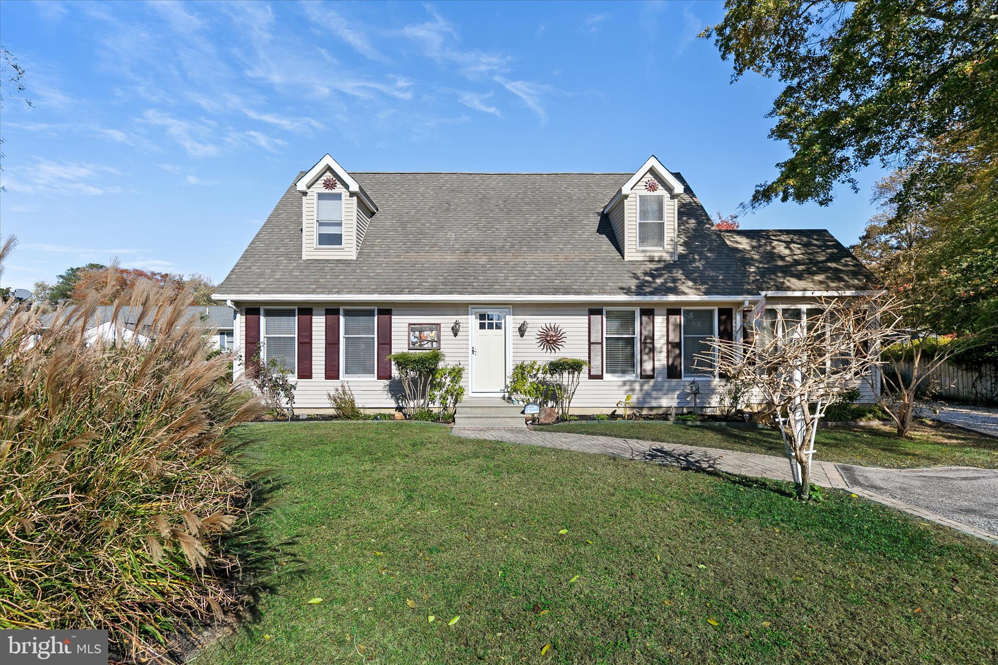 a view of a house with backyard porch and sitting area