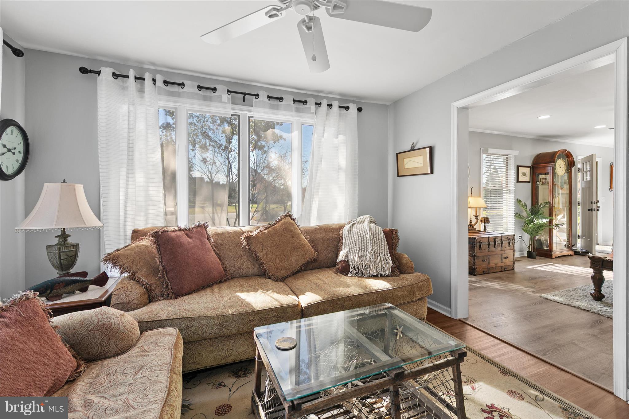 37239 Main Street Ocean View, DE 19970 - Photo 17 of 43 a living room with furniture and a large window