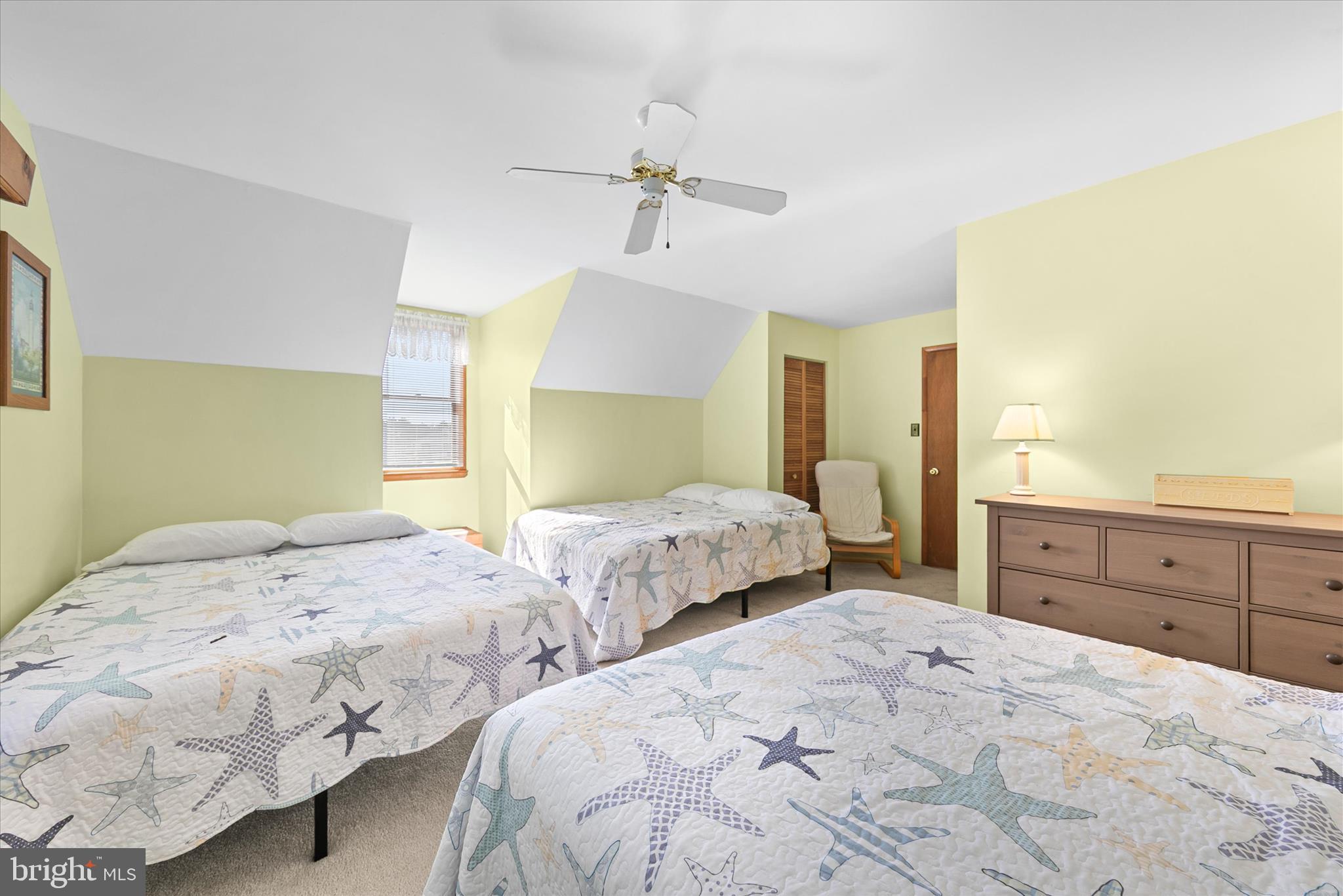 37239 Main Street Ocean View, DE 19970 - Photo 25 of 43 a bedroom with two beds and a dresser