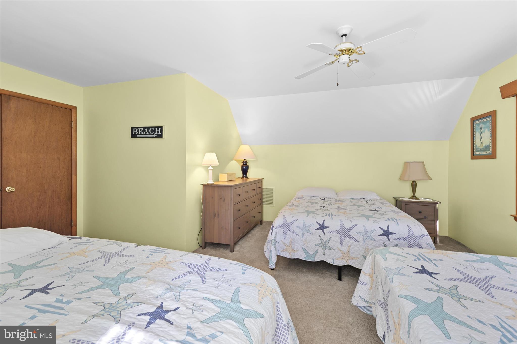 37239 Main Street Ocean View, DE 19970 - Photo 27 of 43 a bedroom with a bed and a dresser