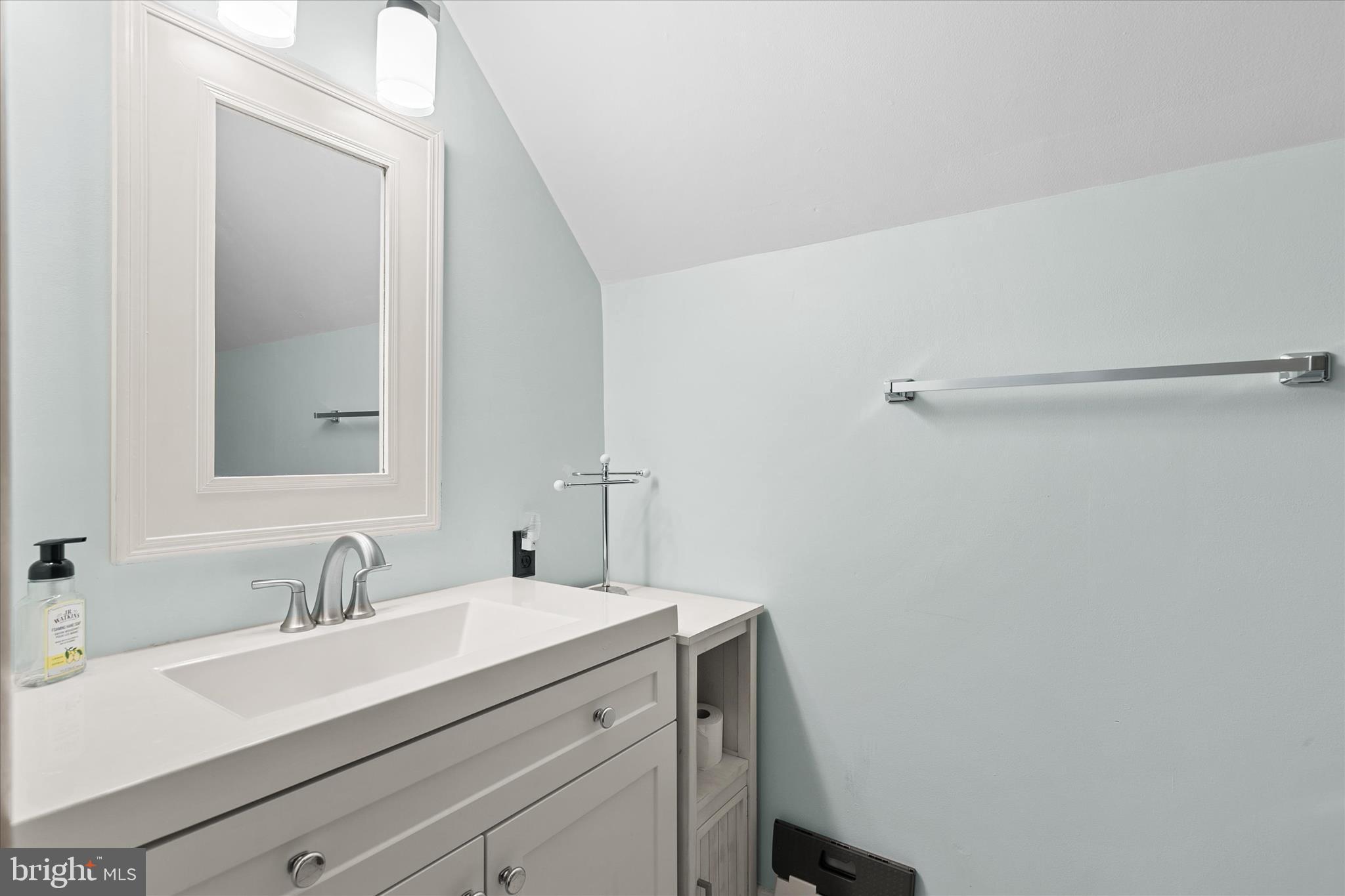 37239 Main Street Ocean View, DE 19970 - Photo 28 of 43 a bathroom with a sink and a mirror