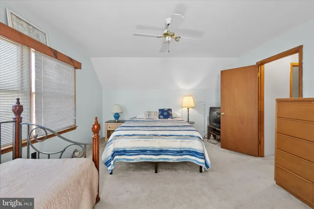 a bedroom with a bed and a table