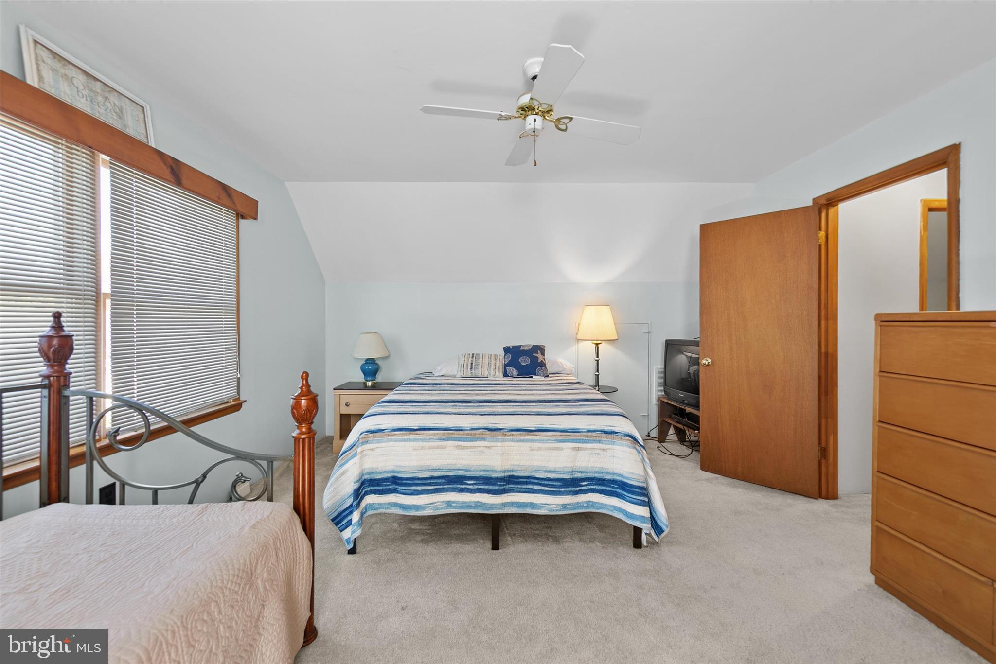 37239 Main Street Ocean View, DE 19970 - Photo 32 of 43 a bedroom with a bed and a table