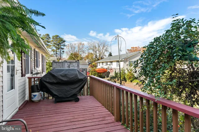 a view of balcony with wooden floor and outdoor seating