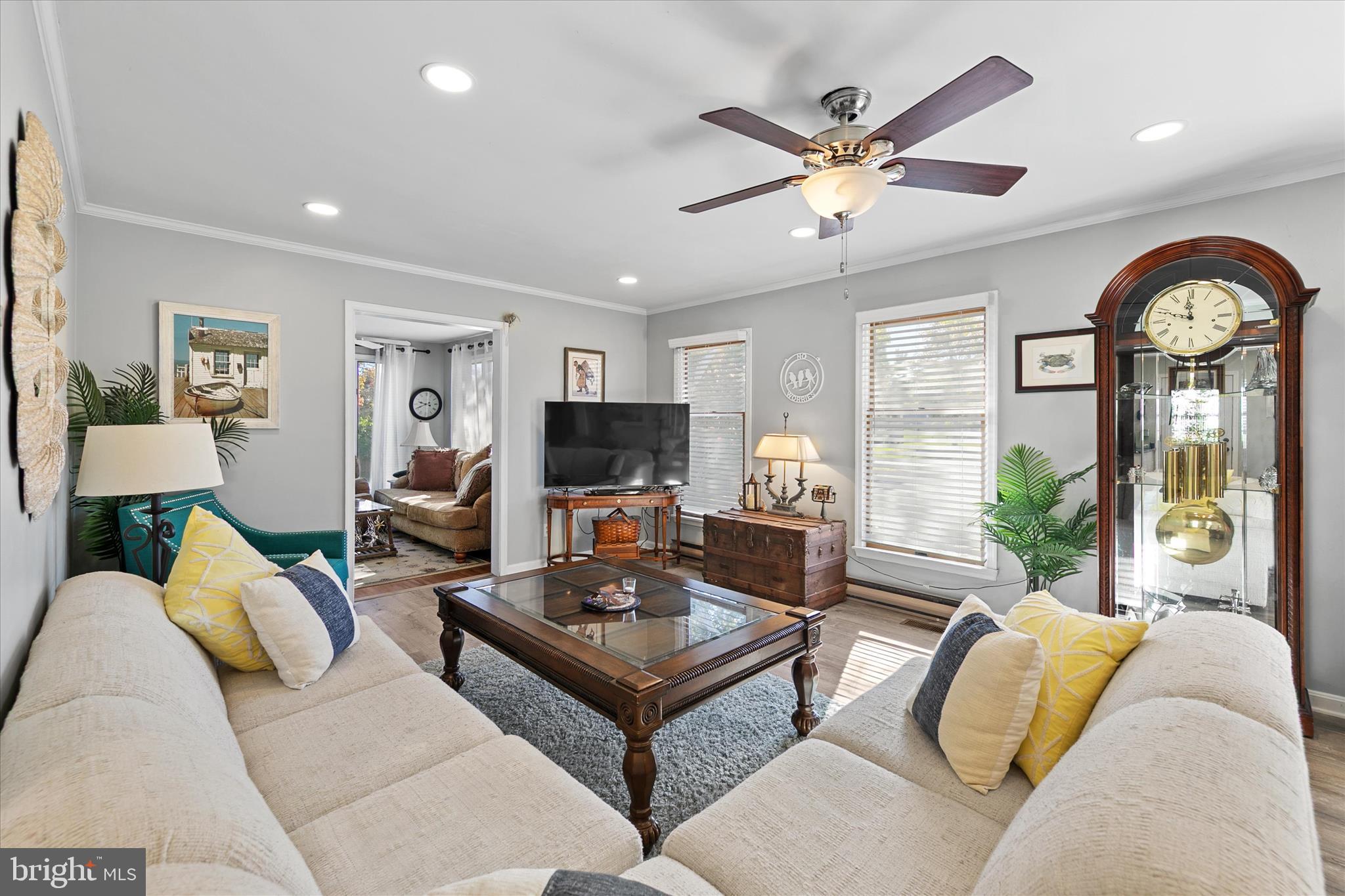 37239 Main Street Ocean View, DE 19970 - Photo 7 of 43 a living room with furniture and a flat screen tv