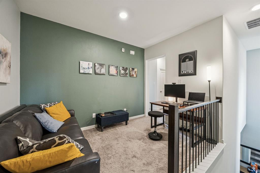 1010 Switchgrass Lane Allen, TX 75013 - Photo 12 of 25 a workspace with furniture and book shelf