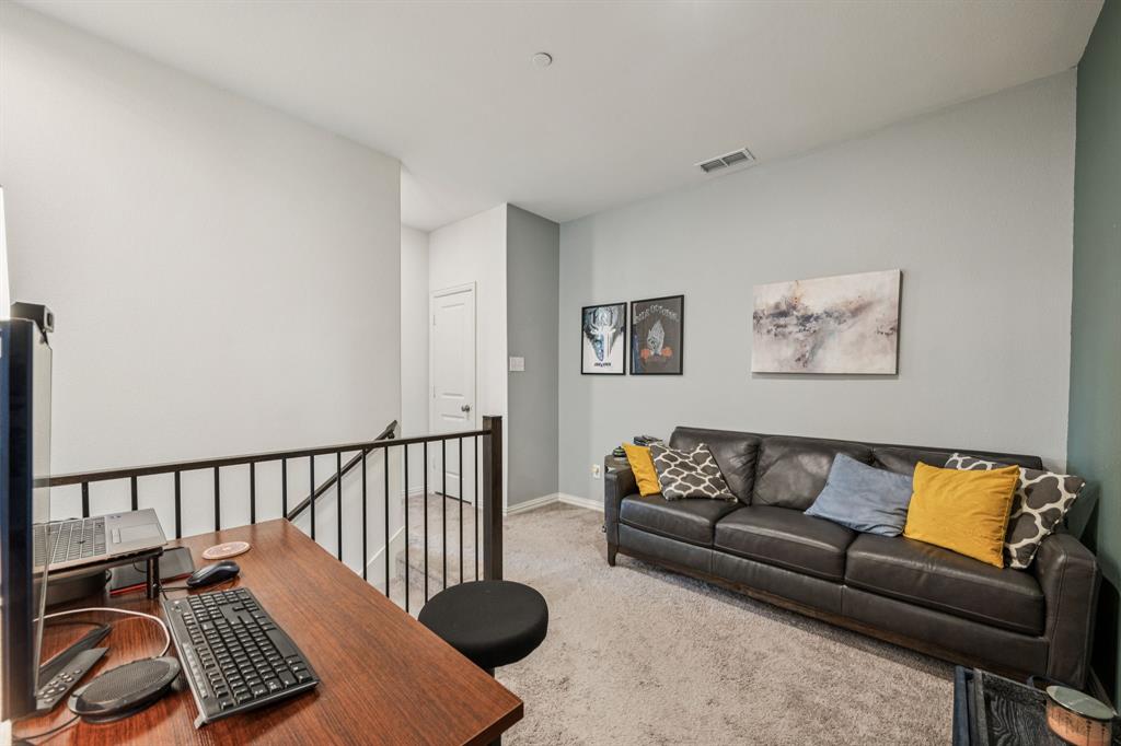 1010 Switchgrass Lane Allen, TX 75013 - Photo 13 of 25 a living room with furniture rug and a window