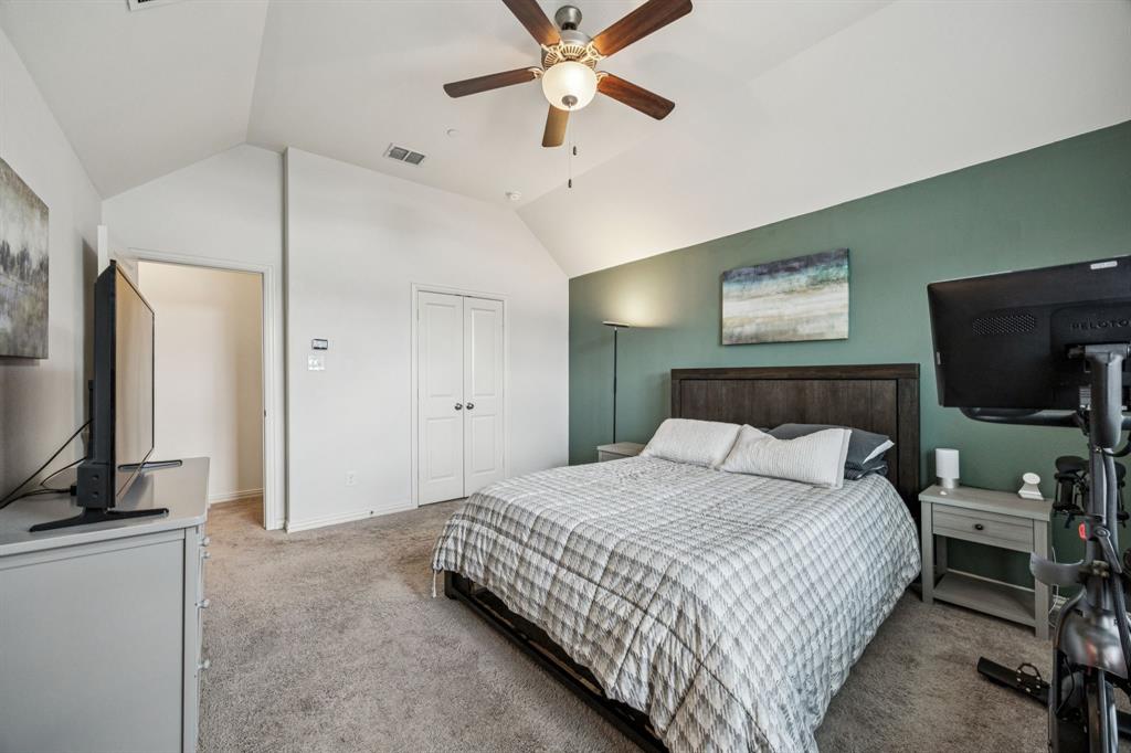 1010 Switchgrass Lane Allen, TX 75013 - Photo 15 of 25 a bedroom with a bed and a flat screen tv