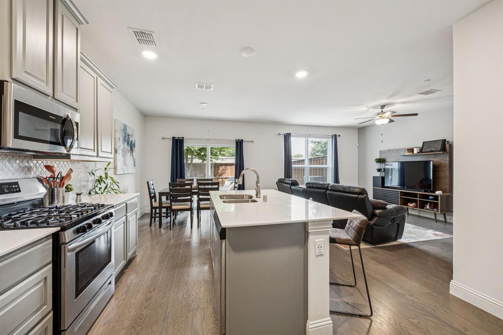 1010 Switchgrass Lane Allen, TX 75013 - Photo 9 of 25 a view of kitchen with stainless steel appliances granite countertop lots of counter top space