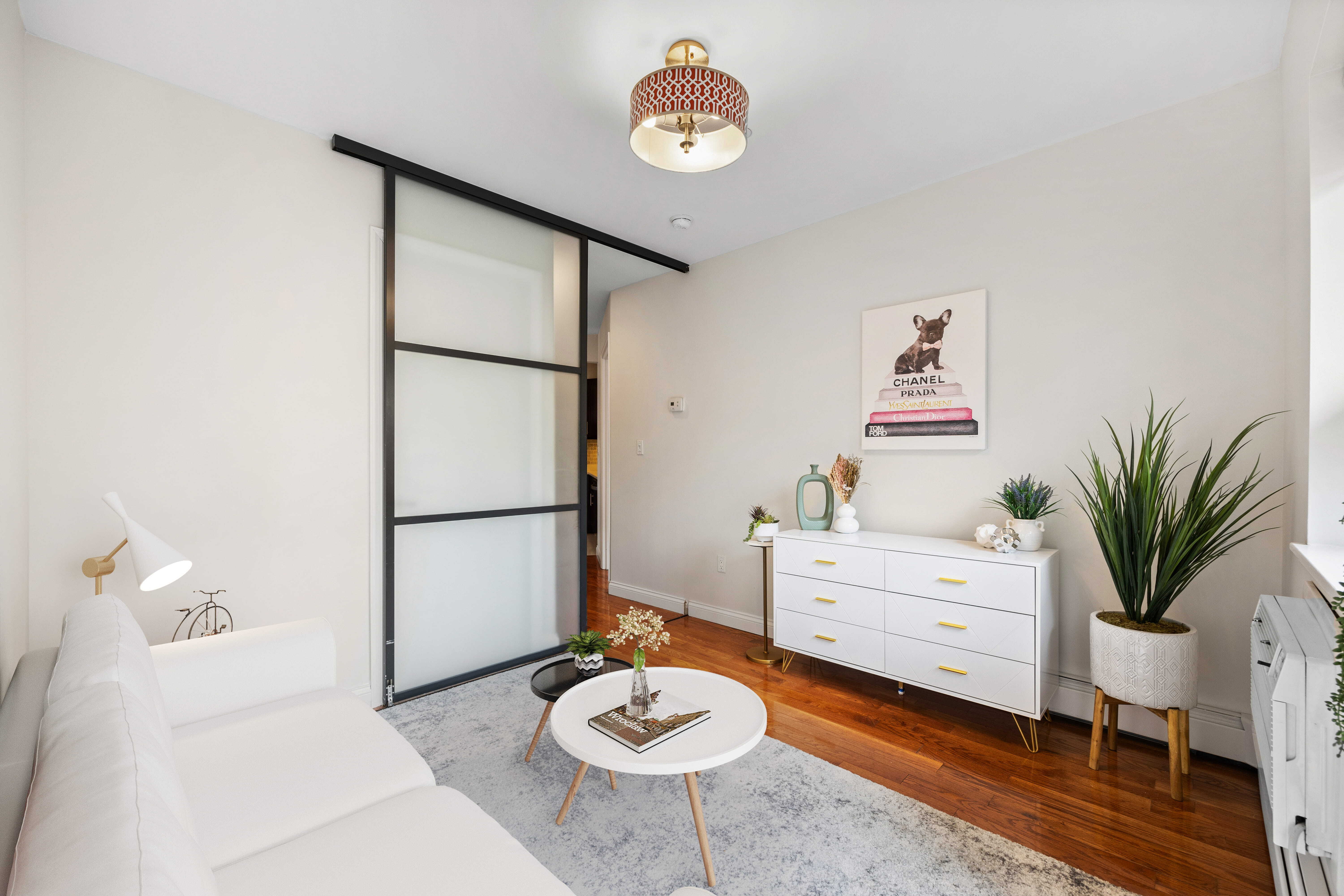 Undisclosed Address Manhattan, NY 10032 - Photo 19 of 19 a living room with furniture and a table