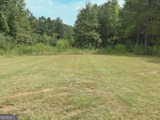 a view of a field with an outdoor space