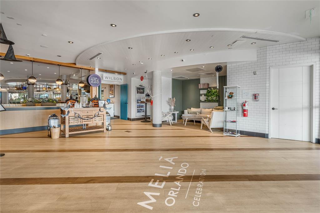 225 Celebration Place, Unit 117 Celebration, FL 34747 - Photo 23 of 30 a view of a living room and kitchen