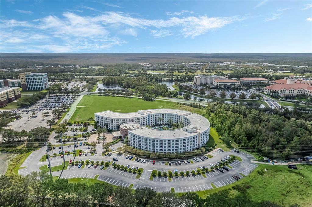 225 Celebration Place, Unit 117 Celebration, FL 34747 - Photo 26 of 30 an aerial view of residential houses with outdoor space and trees