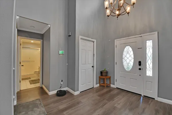 a view of an entryway with wooden floor