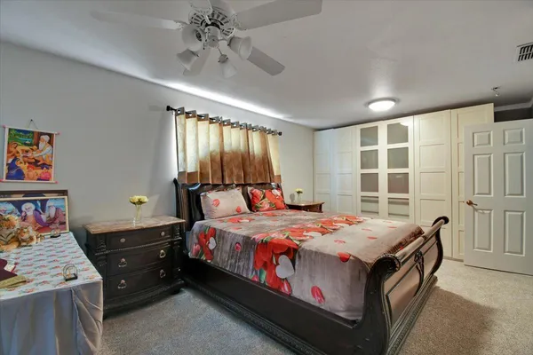 a bed room with a bed and a window