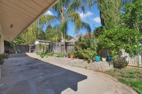 a view of a garden with a patio
