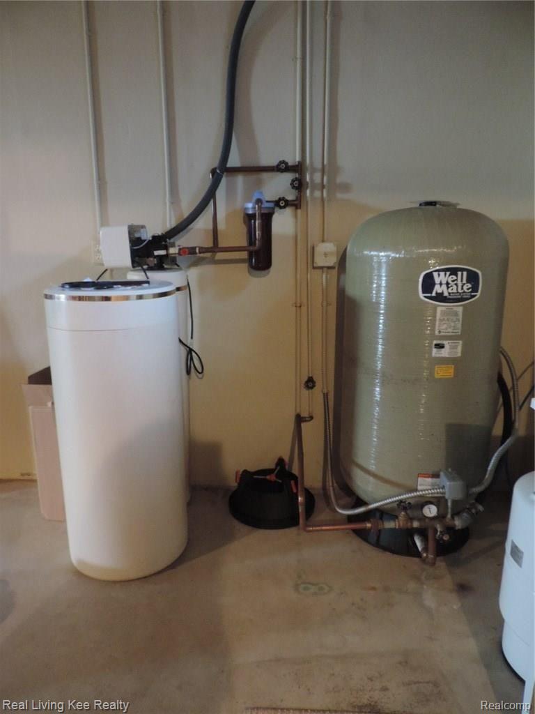 175 Addison Meadows Court Leonard, MI 48367 - Photo 29 of 33 Newer fiberglass well bladder and RO filtration system
