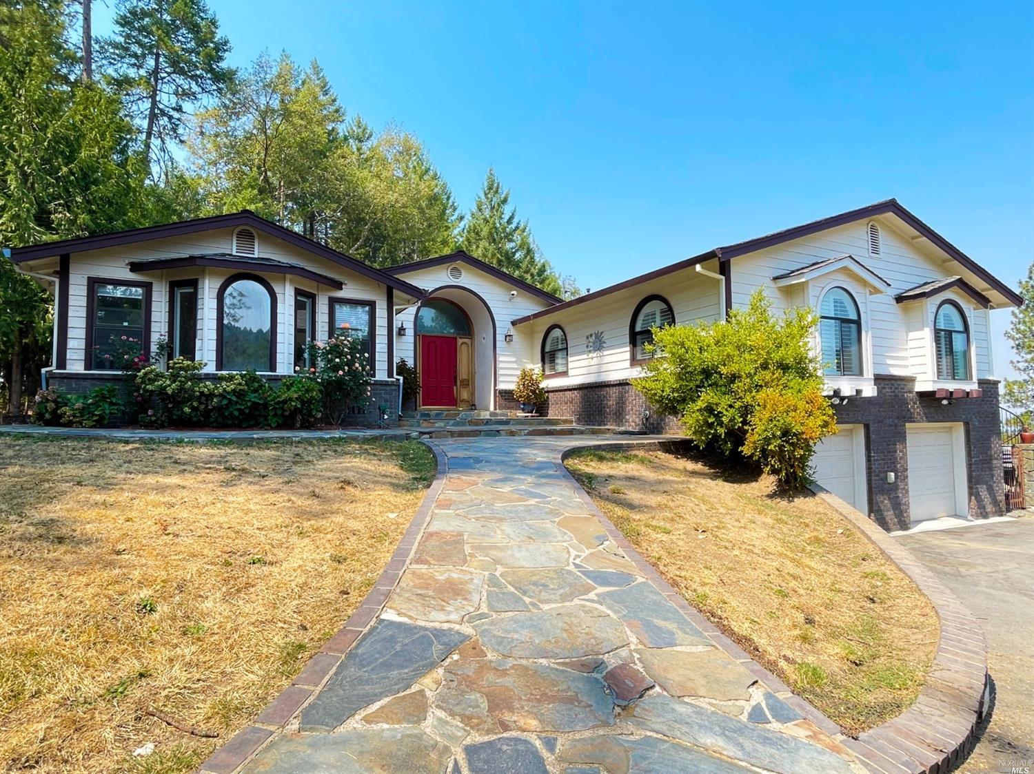 3251 Ridgewood Road Willits, CA 95490 - Photo 1 of 1 a front view of a house with a yard