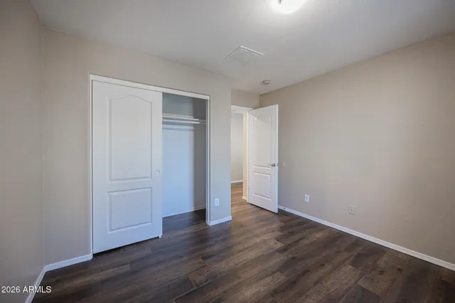 a bathroom with a sink toilet a mirror and shower
