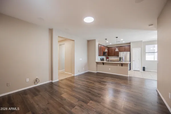 a lobby with furniture and a chandelier