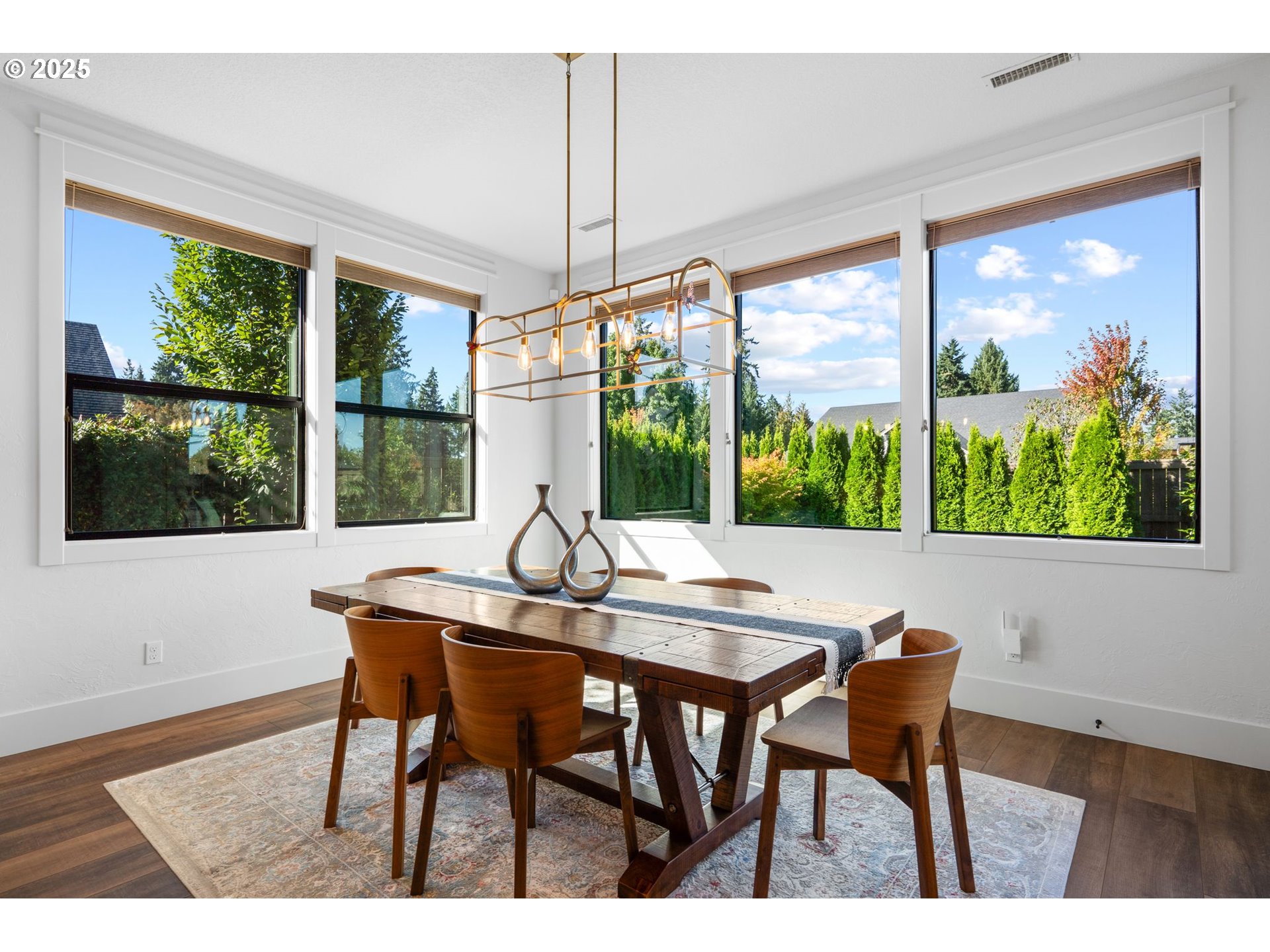 3911 Northwest 114th Street Vancouver, WA 98685 - Photo 11 of 30 a dining room table in a hall with a large window
