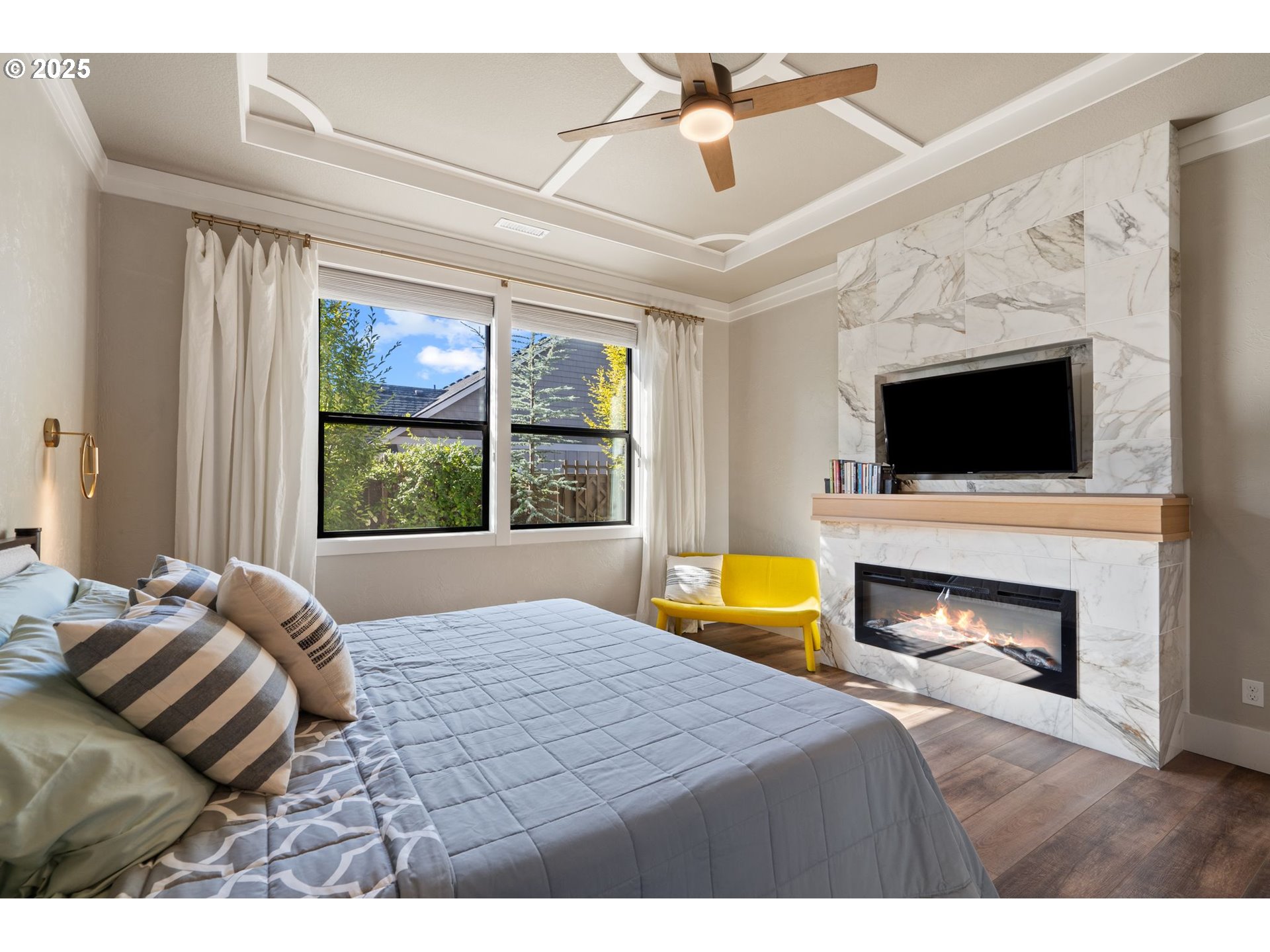 3911 Northwest 114th Street Vancouver, WA 98685 - Photo 13 of 30 a bedroom with a bed and a fireplace