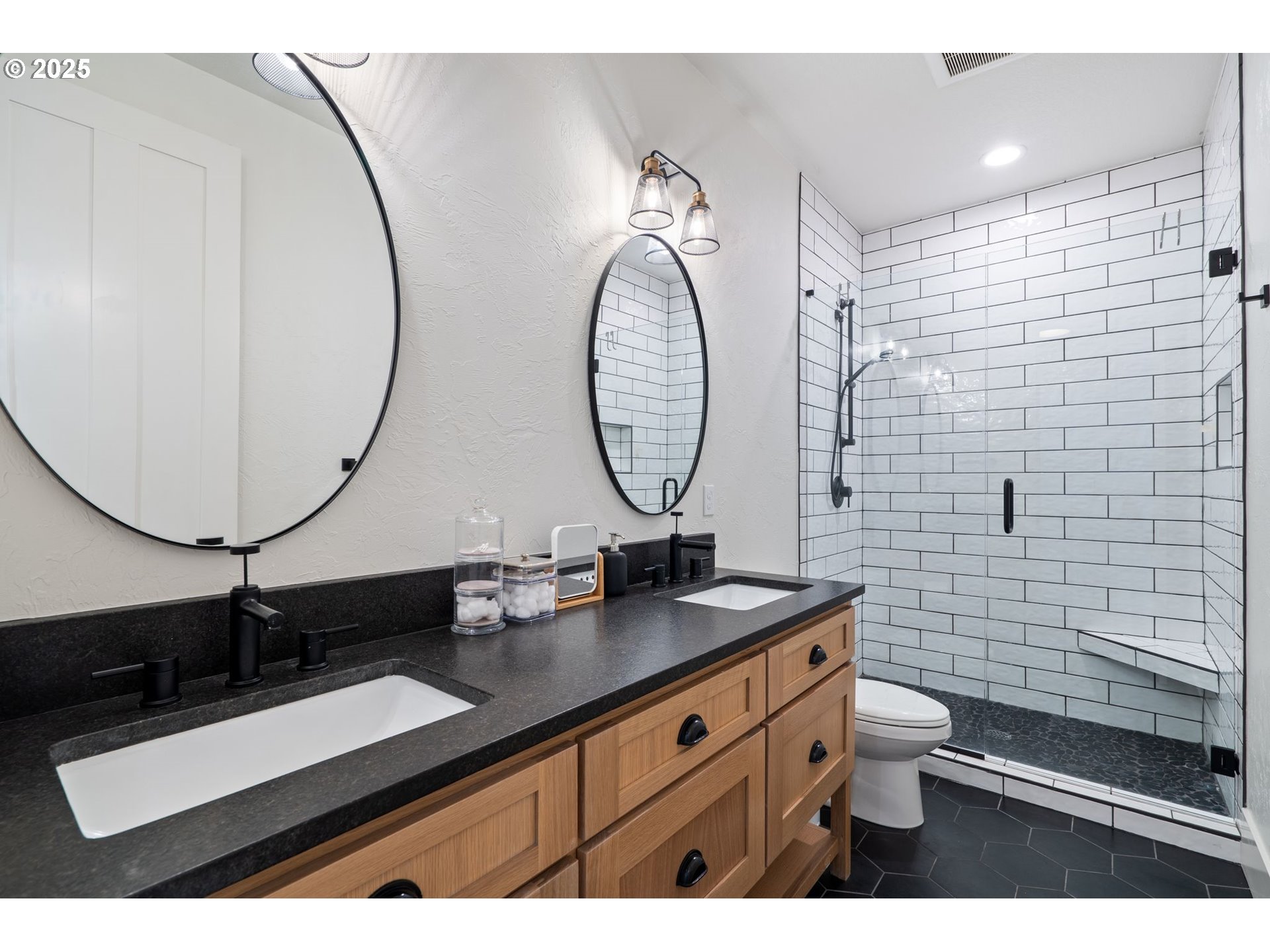 3911 Northwest 114th Street Vancouver, WA 98685 - Photo 16 of 30 a bathroom with a sink a toilet and a mirror